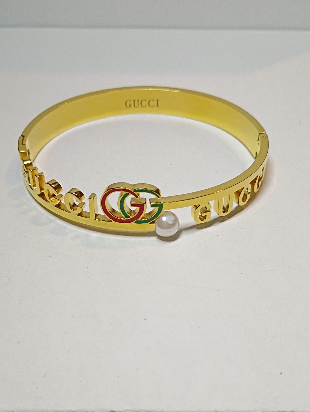 New Double G Inspired Gold-Tone GG Enamel Logo Bangle with Pearl Accent